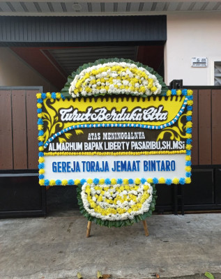 Papan Bunga Duka di Rintis